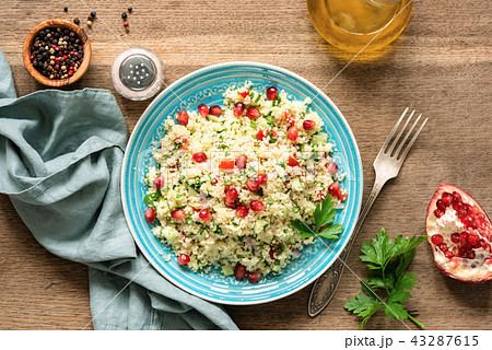 Couscous salad Tabbouleh with pomegranate seeds 43287615