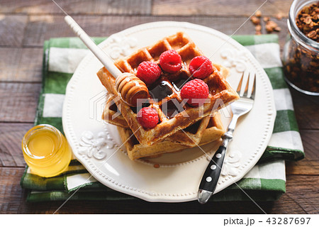 Belgian waffles with raspberries and honey 43287697