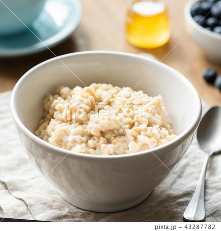 Oatmeal porridge, scottish oats in a bowl 43287782