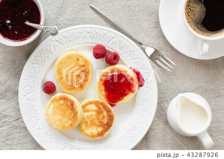 Cottage cheese pancakes with jam and coffee Cottage cheese pancakes with jam and coffee 43287926