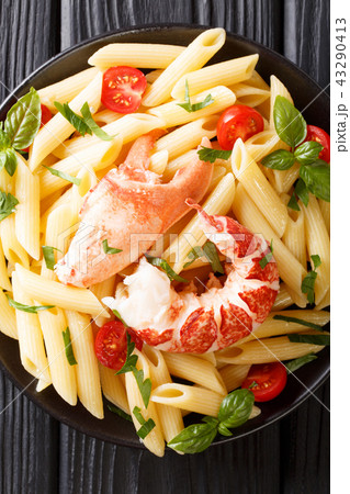 Served Penne pasta with red lobster meat 43290413