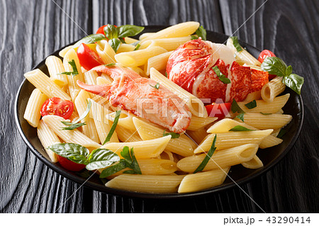 Italian recipe of penne pasta with boiled lobster 43290414