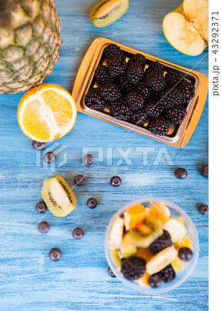 Top view of a cup full of tasty fruits in a cup Top view of a cup full of tasty fruits in a cup 43292371