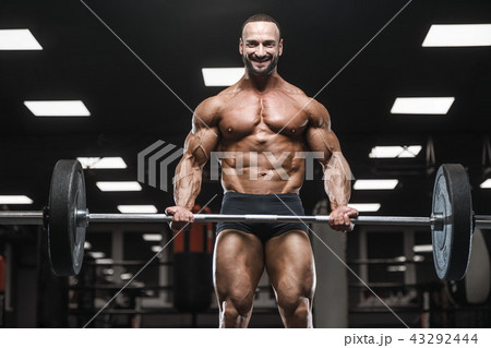 strong bodybuilder athletic men pumping up muscles strong bodybuilder athletic men pumping up muscles 43292444
