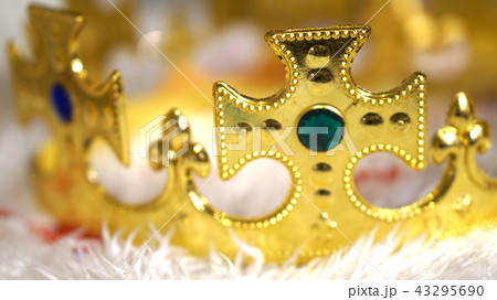 gold crown with diamond on white fur background 43295690