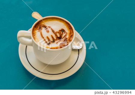 Cappuccino on a cup with foam on table Cappuccino on a cup with foam on table 43296994