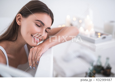 Positive lady having leisure in foam water 43299487