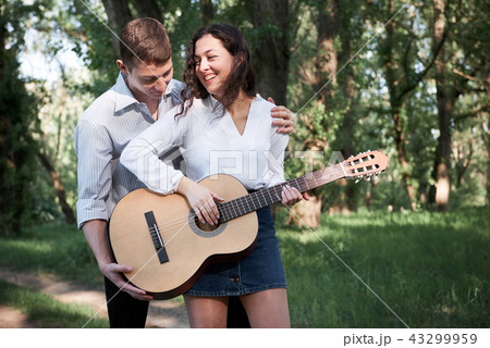 young couple walking in the forest, romantic  43299959