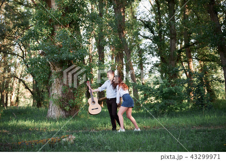 young couple walking in the forest, romantic  43299971