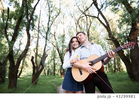 young couple walking in the forest, romantic young couple walking in the forest, romantic 43299981