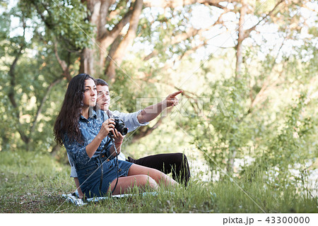 young couple walking in the forest, romantic  young couple walking in the forest, romantic  43300000