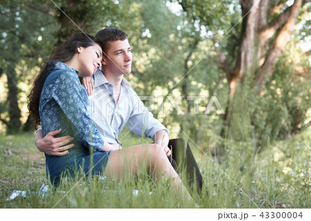 young couple walking in the forest, romantic young couple walking in the forest, romantic 43300004