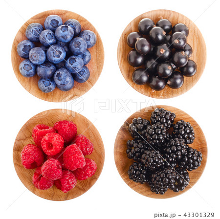 blackberry blueberry raspberry black currant in wooden bowl isolated on white background. Top view 43301329
