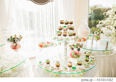 Different kinds of baked sweets on a buffet Different kinds of baked sweets on a buffet 43301582