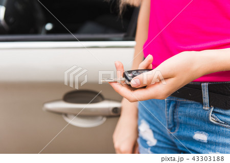 Close up of car key in hand Close up of car key in hand 43303188