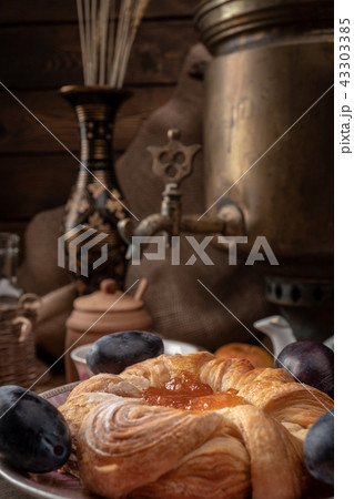 Breakfast with a samovar. Tea and cheesecake with jam 43303385
