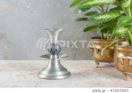 Vintage candlestick on concrete background. 43303903