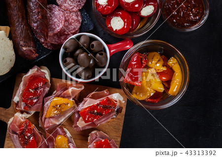 Spanish tapas with slices jamon serrano and other 43313392