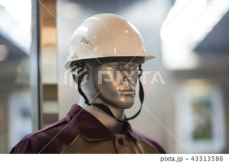 Man mannequin in protective clothes overalls and yellow helmet isolated over white background. Man mannequin in protective clothes overalls and yellow helmet isolated over white background. 43313586