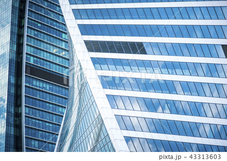 Modern Business Office Building Windows Repeating Pattern, Blue Glass Facade with Geometric Lines Modern Business Office Building Windows Repeating Pattern, Blue Glass Facade with Geometric Lines 43313603
