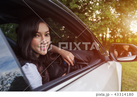 happy young woman in car happy young woman in car 43314180