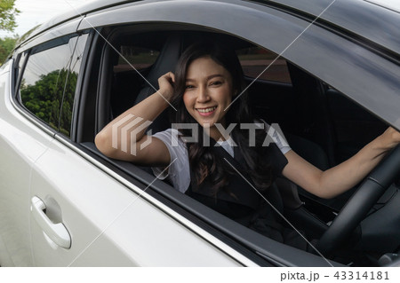 happy young woman in car 43314181