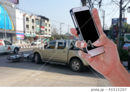 Man using smartphone after car accident Man using smartphone after car accident 43315207