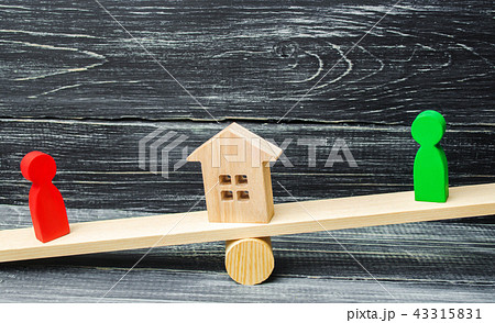wooden figures on the scales. wooden figures on the scales. 43315831