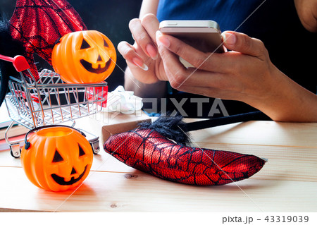 Happy Halloween, Woman using mobile phone Happy Halloween, Woman using mobile phone 43319039