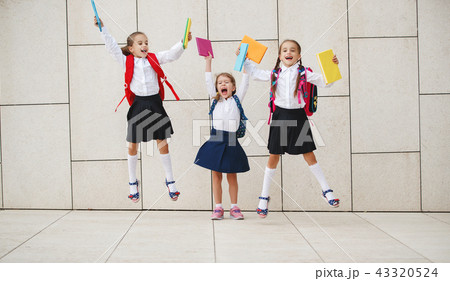 Happy children girlfriend schoolgirl student elementary school Happy children girlfriend schoolgirl student elementary school 43320524
