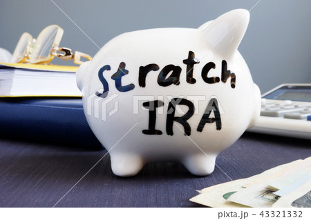 Stretch ira written on a piggy bank. Retirement. 43321332