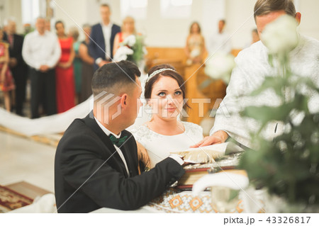 Wedding couple bide and groom get married in a church 43326817