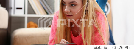 young beautiful blond woman lie on the floor read book young beautiful blond woman lie on the floor read book 43326992