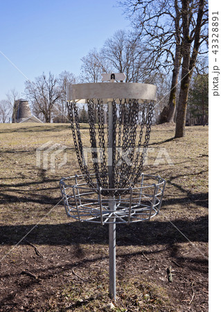 Empty Disc Golf Target on field Empty Disc Golf Target on field 43328891