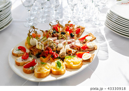 solemn banquet. Lot of glasses champagne or wine on the table in restaurant. buffet table with lots solemn banquet. Lot of glasses champagne or wine on the table in restaurant. buffet table with lots 43330918