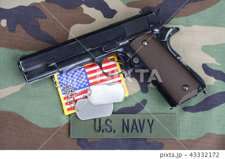 US NAVY branch tape, M1911 handgun with dog tags US NAVY branch tape, M1911 handgun with dog tags 43332172