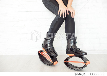 close-up in kangoo jumps boots indoors unrecognizable rear view. 43333390