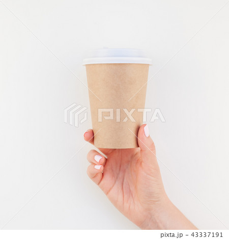 Mock up of coffee cup in female hand 43337191