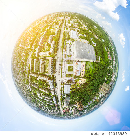 Aerial city view with crossroads and roads, houses, buildings, parks and parking lots. Sunny summer 43338980