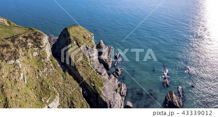 Aerial view of the beautiful cliffs close to the historic South Stack lighthouse on Anglesey - Wales 43339012