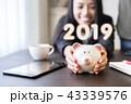 Successful business 2019.hands holding piggy bank. 43339576