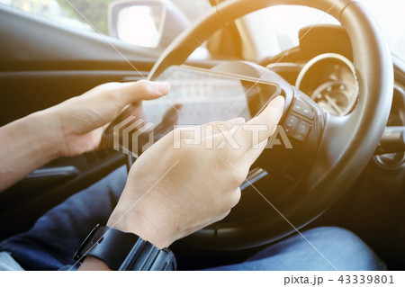 using digital tablet while driving the car using digital tablet while driving the car 43339801
