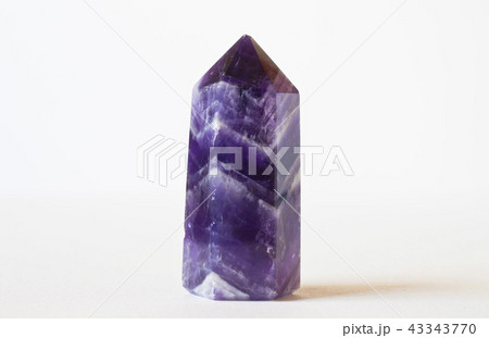purple crystal upright in white background 43343770