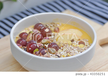 mango yogurt with apple, oat, pistachio and grape 43350251
