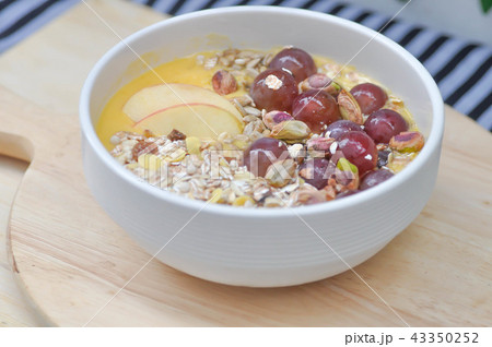 mango yogurt with apple, oat, pistachio and grape 43350252