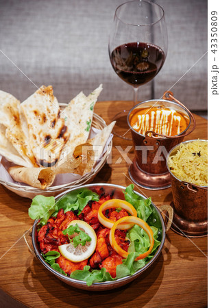 Chicken tandoori with tikka masala sauce, Papadum Chicken tandoori with tikka masala sauce, Papadum 43350809