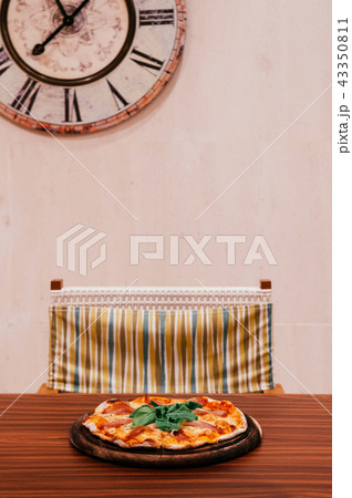 Italian margherita pizza with parma ham and basil Italian margherita pizza with parma ham and basil 43350811