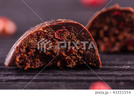 Chocolate candies it is made hands with red pepper Chocolate candies it is made hands with red pepper 43351554