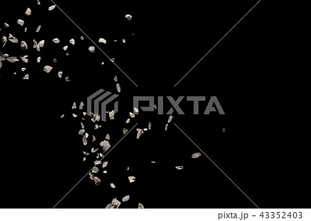 Split debris of stone exploding against black. 43352403