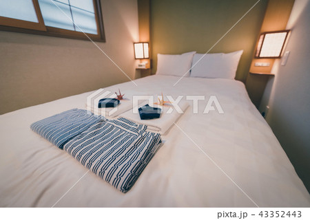 Japanese yukata and towel on bedroom in hotel 43352443